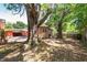 Backyard featuring a spacious patio, mature trees, and shade, creating a beautiful outdoor space at 7401 11Th N Ave, St Petersburg, FL 33710