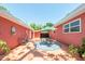 Spacious backyard with a patio area, perfect for outdoor entertaining and relaxation with mature trees at 7401 11Th N Ave, St Petersburg, FL 33710