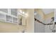 Bathroom featuring updated vanity, tiled shower, and good lighting at 7401 11Th N Ave, St Petersburg, FL 33710