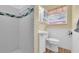 Bathroom with shower, toilet, sink, and storage cabinet at 7401 11Th N Ave, St Petersburg, FL 33710