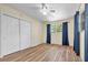 Bedroom features wood-look floors and a closet at 7401 11Th N Ave, St Petersburg, FL 33710