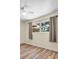 Bedroom with wood-look floors and a view of outside at 7401 11Th N Ave, St Petersburg, FL 33710