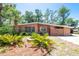Charming single-story home boasting lush landscaping and mature trees, creating a welcoming curb appeal at 7401 11Th N Ave, St Petersburg, FL 33710