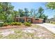 Charming single-story home with lush landscaping, a well-manicured lawn, and a welcoming curb appeal at 7401 11Th N Ave, St Petersburg, FL 33710