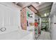 Laundry room with washer, dryer, and storage shelves at 7401 11Th N Ave, St Petersburg, FL 33710