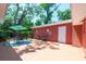 Charming patio area with outdoor seating and mature trees offering shade, perfect for relaxing or entertaining at 7401 11Th N Ave, St Petersburg, FL 33710