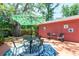 Inviting patio with a table, chairs, and shade umbrella, creating a cozy and functional outdoor living space at 7401 11Th N Ave, St Petersburg, FL 33710