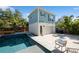 Backyard featuring a pool, spa, outdoor seating, a privacy fence, and a two-story home at 790 36Th N Ave, St Petersburg, FL 33704