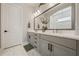 Elegant bathroom featuring double vanity, stylish fixtures, and a large mirror at 790 36Th N Ave, St Petersburg, FL 33704