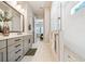Luxurious bathroom boasts double vanity, large mirror, and glass-enclosed shower at 790 36Th N Ave, St Petersburg, FL 33704