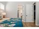 Bedroom with plank floors and ensuite bath; easy access from the main bedroom at 790 36Th N Ave, St Petersburg, FL 33704