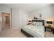 Neutral bedroom features a gray upholstered headboard with matching lamps and carpeted floors at 790 36Th N Ave, St Petersburg, FL 33704