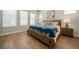 Bright bedroom with natural light, wood floors, and stylish decor, creating a relaxing atmosphere at 790 36Th N Ave, St Petersburg, FL 33704