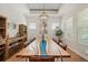Elegant dining room featuring a large table, chandelier, and ample natural light at 790 36Th N Ave, St Petersburg, FL 33704