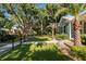 Expansive manicured lawn and lush landscaping around the home's exterior at 790 36Th N Ave, St Petersburg, FL 33704