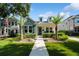 Charming home with manicured lawn, lush landscaping, and a welcoming walkway at 790 36Th N Ave, St Petersburg, FL 33704