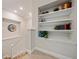 Hallway landing featuring built-in bookshelves and natural light, adding warmth and charm at 790 36Th N Ave, St Petersburg, FL 33704
