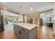 Spacious kitchen with island offering views to dining room and living room with backyard pool at 790 36Th N Ave, St Petersburg, FL 33704