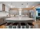 Spacious kitchen featuring gray cabinets, stainless steel appliances, and an oversized island with bar stool seating at 790 36Th N Ave, St Petersburg, FL 33704