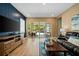 Modern living room with a view of outdoor pool area through sliding glass doors at 790 36Th N Ave, St Petersburg, FL 33704