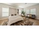 Bright living room with a murphy bed, sofa, light-colored walls, and hardwood floors with area rug at 790 36Th N Ave, St Petersburg, FL 33704