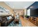 Modern living room with dark leather sofa and view of the open kitchen area at 790 36Th N Ave, St Petersburg, FL 33704
