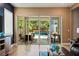 Bright living room featuring large sliding glass doors providing natural light and access to the backyard pool at 790 36Th N Ave, St Petersburg, FL 33704