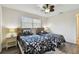 Bright bedroom with two beds, a large window, and laminate flooring at 854 Village Way, Palm Harbor, FL 34683
