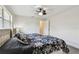 Sunlit bedroom featuring laminate flooring and a large window at 854 Village Way, Palm Harbor, FL 34683