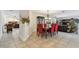 Well-lit dining room with red upholstered chairs, wooden table, and an open-concept design at 854 Village Way, Palm Harbor, FL 34683
