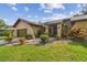 Well-maintained home featuring beautiful landscaping and an inviting walkway to the front door at 854 Village Way, Palm Harbor, FL 34683