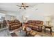 Spacious living room with hardwood floors, ceiling fan, and comfortable seating at 854 Village Way, Palm Harbor, FL 34683
