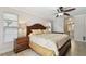 Well-lit main bedroom with a window and adjacent bathroom at 854 Village Way, Palm Harbor, FL 34683