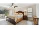 Cozy main bedroom with access to the lanai and tile flooring at 854 Village Way, Palm Harbor, FL 34683