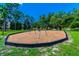 Community playground with swings and a wood chip surface, providing a safe and fun area for children to play at 854 Village Way, Palm Harbor, FL 34683