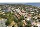 Scenic aerial view of waterfront property showcasing the city's waterways, lush greenery, and surrounding neighborhood at 904 Villa Venicia Way, Tampa, FL 33606