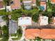 Birds eye view of neighborhood homes that shows roof type, surrounding pool and greenery, and neighborhood layout at 904 Villa Venicia Way, Tampa, FL 33606