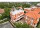 Aerial view showcasing orange roofed townhomes in the neighborhood at 904 Villa Venicia Way, Tampa, FL 33606