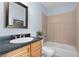 Cozy bathroom featuring a bathtub and shower combo with dark countertop at 904 Villa Venicia Way, Tampa, FL 33606