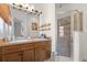 Bright bathroom featuring a double sink vanity and a glass-enclosed shower at 904 Villa Venicia Way, Tampa, FL 33606