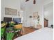 Comfortable bedroom with a computer desk, hardwood floors, and natural lighting at 904 Villa Venicia Way, Tampa, FL 33606