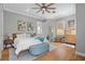 Bright, airy bedroom with a ceiling fan and hardwood floors at 904 Villa Venicia Way, Tampa, FL 33606