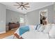 Bedroom with ceiling fan and an organized walk in closet at 904 Villa Venicia Way, Tampa, FL 33606