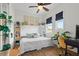 Cozy bedroom with hardwood floors, bright windows, and built-in bookshelves at 904 Villa Venicia Way, Tampa, FL 33606