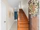 Inviting entryway featuring hardwood stairs and neutral wall colors at 904 Villa Venicia Way, Tampa, FL 33606