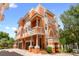 A bright, multi-story home featuring balconies, columns, and a two-car garage at 904 Villa Venicia Way, Tampa, FL 33606