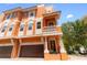 Beautiful three story home featuring balconies, columns, and a two-car garage at 904 Villa Venicia Way, Tampa, FL 33606