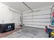 Spacious garage featuring a white door, ample storage space, and concrete flooring at 904 Villa Venicia Way, Tampa, FL 33606