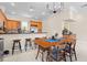 Modern kitchen with stainless steel appliances, breakfast bar, and adjacent dining area, perfect for gatherings at 904 Villa Venicia Way, Tampa, FL 33606