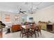 Well-lit living room with modern decor, seamlessly connected to dining area, offers versatile space for entertaining at 904 Villa Venicia Way, Tampa, FL 33606